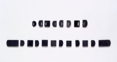  <em>Set of 20 Belt Ornaments</em>, after the 8th century. Black stone, rectangular pieces: 1 5/8 x 3 1/8 x 1/4 in. (4.2 x 8 x 0.7 cm). Brooklyn Museum, Brooklyn Museum Collection, 27.977.15a-t. Creative Commons-BY (Photo: Brooklyn Museum, 27.977.15a-t.jpg)