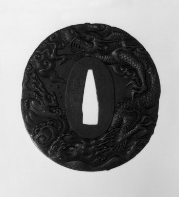  <em>Sword Guard</em>, n.d. Iron, 2 3/4 x 2 9/16 x 3/16 in. (7 x 6.5 x 0.4 cm). Brooklyn Museum, Gift of F. Ethel Wickham, 28.710. Creative Commons-BY (Photo: Brooklyn Museum, 28.710_front_bw.jpg)