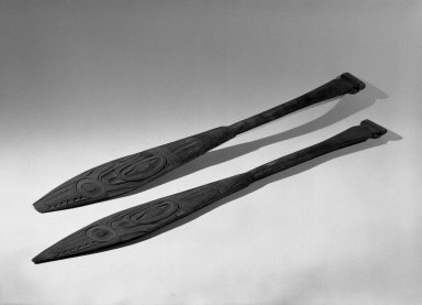 Tlingit. <em>Flat Carved Paddle, One of Pair</em>, 19th century. Wood, 24 7/8 x 3 3/16 in. (63.2 x 8.1 cm). Brooklyn Museum, Gift of Charlotte Elizabeth Dudley, 30.1468.1. Creative Commons-BY (Photo: , 30.1468.1_30.1468.2_acetate_bw.jpg)