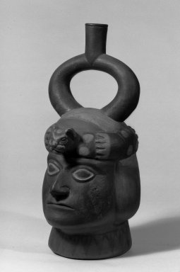 Moche. <em>Male Portrait Jar, Brown, Red and White</em>. Ceramic, 10 1/2 × 6 × 6 in. (26.7 × 15.2 × 15.2 cm). Brooklyn Museum, 30.887. Creative Commons-BY (Photo: Brooklyn Museum, 30.887_acetate_bw.jpg)