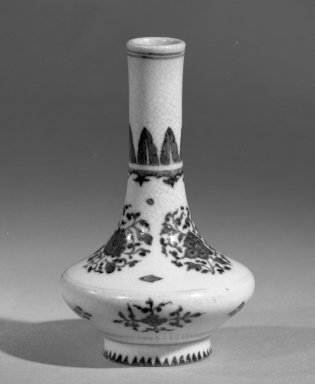  <em>Vase</em>, 1662–1722. Porcelain with cobalt-blue underglaze decoration (roasted blue-and-white), 4 1/8 x 2 5/8 in. (10.5 x 6.7 cm). Brooklyn Museum, Gift of the executors of the Estate of Colonel Michael Friedsam, 32.987. Creative Commons-BY (Photo: Brooklyn Museum, 32.987_acetate_bw.jpg)