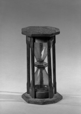 <em>Hour Glass</em>. Glass, wood, Height: 6 1/2 in. (16.5 cm). Brooklyn Museum, Frank L. Babbott Fund, Henry L. Batterman Fund, Carll H. de Silver Fund, A. Augustus Healy Fund, Frederick Loeser Fund, Charles Stewart Smith Memorial Fund, Ella C. Woodward Memorial Fund, and Museum Collection Fund, 32.99.11. Creative Commons-BY (Photo: Brooklyn Museum, 32.99.11_acetate_bw.jpg)