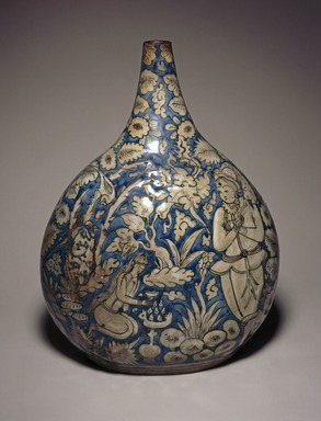  <em>Bottle Depicting a Hunting Scene</em>, first half 17th century. Ceramic; fritware, painted in cobalt blue and black on an opaque white glaze, 11 1/2 × 8 1/4 × 5 1/4 in. (29.2 × 21 × 13.3 cm). Brooklyn Museum, Brooklyn Museum Collection, 34.6024. Creative Commons-BY (Photo: Brooklyn Museum, 34.6024_side1_SL1.jpg)