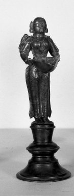  <em>Dipa Lakshmi or Figure of Lakshmi Used as Lamp</em>, 18th century. Brass, 9 1/2 x 3 3/8 in. (24.2 x 8.5 cm). Brooklyn Museum, Brooklyn Museum Collection, 34.742. Creative Commons-BY (Photo: Brooklyn Museum, 34.742_acetate_bw.jpg)