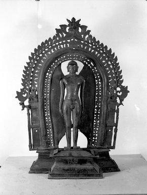  <em>Jina Mahavira</em>, 11th-12th century (image); 16th century (base and halo). Bronze, 24 1/2 × 18 1/2 × 7 7/8 in. (62.2 × 47 × 20 cm). Brooklyn Museum, Robert B. Woodward Memorial Fund, 34.752a-b. Creative Commons-BY (Photo: Brooklyn Museum, 34.752_acetate_bw.jpg)