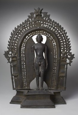  <em>Jina Mahavira</em>, 11th-12th century (image); 16th century (base and halo). Bronze, 24 1/2 × 18 1/2 × 7 7/8 in. (62.2 × 47 × 20 cm). Brooklyn Museum, Robert B. Woodward Memorial Fund, 34.752a-b. Creative Commons-BY (Photo: Brooklyn Museum, 34.752_front_PS11.jpg)