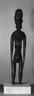 Rapanui. <em>Standing Male Figure (Moai Kavakava)</em>. Wood, bead or shell, 15 1/2 x 3 1/4 x 2 1/4 in. (39.4 x 8.3 x 5.7 cm). Brooklyn Museum, George C. Brackett Fund, 34.998. Creative Commons-BY (Photo: Brooklyn Museum, 34.998_acetate_bw.jpg)