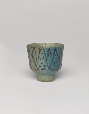 <em>Cup with Lotus Decoration</em>, ca. 1938-1539 B.C.E. Faience, 1 11/16 × Diam. 1 11/16 in. (4.3 × 4.3 cm). Brooklyn Museum, Charles Edwin Wilbour Fund, 35.1275. Creative Commons-BY (Photo: , 35.1275_PS9.jpg)
