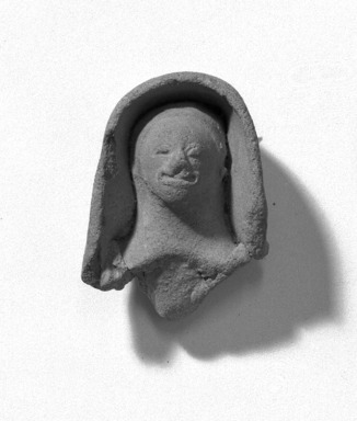  <em>Face Set in Niche</em>. Clay Brooklyn Museum, Gift of Dr. Ernest Franco, 35.1805. Creative Commons-BY (Photo: Brooklyn Museum, 35.1805_acetate_bw.jpg)