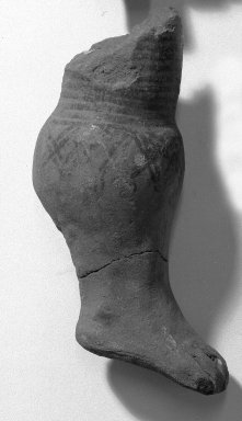  <em>Fragment in Shape of Leg</em>. Clay Brooklyn Museum, Gift of Dr. Ernest Franco, 35.1831. Creative Commons-BY (Photo: Brooklyn Museum, 35.1831_acetate_bw.jpg)
