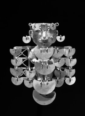  <em>Pendant of Seated Woman</em>. Alloy of gold and copper (tumbaga), 4 13/16 x 3 15/16in. (12.2 x 10cm). Brooklyn Museum, Alfred W. Jenkins Fund, 35.196. Creative Commons-BY (Photo: Brooklyn Museum, 35.196_after_restoration_acetate_bw.jpg)
