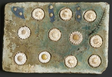  <em>Tile with Floral Inlays</em>, ca. 1352-1336 B.C.E. Faience, 4 3/8 x 1/4 x 6 1/2 in. (11.1 x 0.7 x 16.5 cm). Brooklyn Museum, Gift of the Egypt Exploration Society, 35.2001. Creative Commons-BY (Photo: Brooklyn Museum, 35.2001_SL1.jpg)