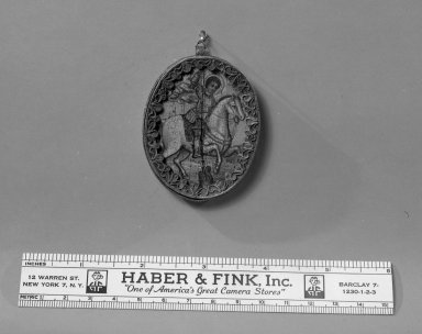 Byzantine. <em>A Thin Oval, Framed -Image of Madonna and child</em>, 15th century. Wood, paint, metal with inlay, 2 3/8 x 1 15/16 in. (6 x 5 cm). Brooklyn Museum, Frank L. Babbott Fund and Henry L. Batterman Fund, 36.201 (Photo: Brooklyn Museum, 36.201_view1_acetate_bw.jpg)