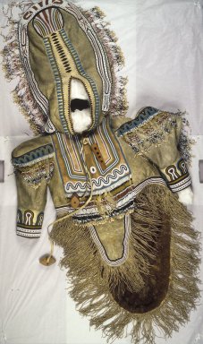 Iñupiaq. <em>Woman's Beaded and Fringed Wedding Dress</em>, 1900–1930. Caribou hide, caribou teeth, wood, beads, 63 x 29 in. (160 x 73.7 cm). Brooklyn Museum, Frank L. Babbott Fund, 36.31. Creative Commons-BY (Photo: Brooklyn Museum, 36.31.jpg)