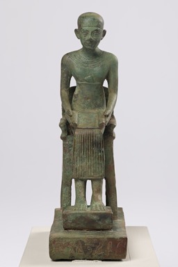 <em>Statuette of Imhotep</em>, 381-30 B.C.E. Coppery alloy, 6 15/16 × 2 3/16 × 4 5/8 in. (17.7 × 5.5 × 11.7 cm). Brooklyn Museum, Charles Edwin Wilbour Fund, 36.623. Creative Commons-BY (Photo: Brooklyn Museum, 36.623_front_PS20.jpg)