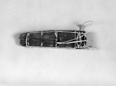 Alaska Native. <em>Model of Toboggan</em>, 1900-1930. Whale bone, hide, wood, 6 x 1 3/4 x 3/4 in. or (15.3 x 4.3 cm). Brooklyn Museum, Gift of Frank K. Fairchild, 36.75. Creative Commons-BY (Photo: Brooklyn Museum, 36.75_bw.jpg)