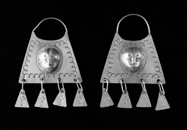 Mapuche. <em>Pair of Earrings</em>, 18th–19th century. Silver, a: 5 5/16 x 3 1/2 x 1/8 in. (13.5 x 8.9 x 0.3 cm.). Brooklyn Museum, Ella C. Woodward Memorial Fund, 36.931a-b. Creative Commons-BY (Photo: Brooklyn Museum, 36.931a-b_bw.jpg)