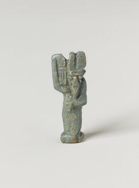  <em>Amun-Min Amulet</em>, 664-343 B.C.E. Faience, 1 1/16 × 3/8 × 1/4 in. (2.7 × 1 × 0.6 cm). Brooklyn Museum, Charles Edwin Wilbour Fund, 37.1037E. Creative Commons-BY (Photo: Brooklyn Museum, 37.1037E_PS4.jpg)