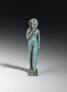  <em>Amulet of the Child Horus</em>, 664-332 B.C.E. Faience, 3 1/16 × 3/4 × 1 in. (7.7 × 1.9 × 2.6 cm). Brooklyn Museum, Charles Edwin Wilbour Fund, 37.1095E. Creative Commons-BY (Photo: Brooklyn Museum, 37.1095E_front_PS2.jpg)