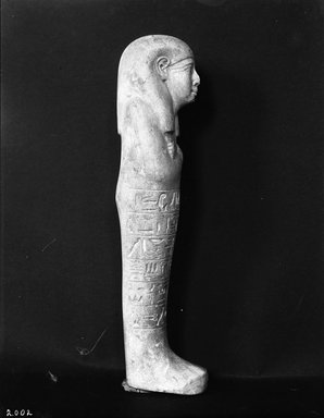  <em>Shabty of the Woman Ahhotep</em>, ca. 1514-1425 B.C.E. Limestone, 8 9/16 x 2 11/16 x 1 3/4 in. (21.7 x 6.9 x 4.5 cm). Brooklyn Museum, Charles Edwin Wilbour Fund, 37.122E. Creative Commons-BY (Photo: Brooklyn Museum, 37.122E_NegA_glass_bw_SL4.jpg)