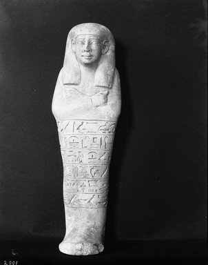  <em>Shabty of the Woman Ahhotep</em>, ca. 1514–1425 B.C.E. Limestone, 8 9/16 x 2 11/16 x 1 3/4 in. (21.7 x 6.9 x 4.5 cm). Brooklyn Museum, Charles Edwin Wilbour Fund, 37.122E. Creative Commons-BY (Photo: Brooklyn Museum, 37.122E_NegB_glass_bw_SL4.jpg)