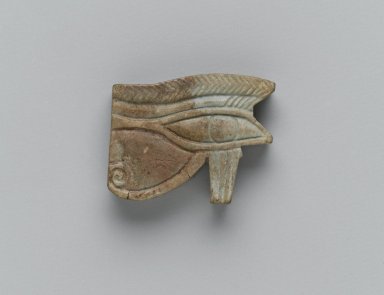 Egyptian. <em>Wadjet-eye Amulet</em>, 664–30 B.C.E. Faience, 7/8 x 1/4 x 1 1/8 in. (2.2 x 0.6 x 2.8 cm). Brooklyn Museum, Charles Edwin Wilbour Fund, 37.1294E. Creative Commons-BY (Photo: Brooklyn Museum, 37.1294E_side1_PS2.jpg)