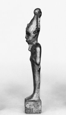  <em>Small Figure of Osiris and Separate Base</em>, ca. 1075-656 B.C.E. Wood, gesso, gold leaf, pigment, linen, Figure: 5 7/16 x 1 3/16 x 7/8 in. (13.8 x 3 x 2.2 cm). Brooklyn Museum, Charles Edwin Wilbour Fund, 37.1376Ea-b. Creative Commons-BY (Photo: Brooklyn Museum, 37.1376Ea-b_glass_SL1.jpg)