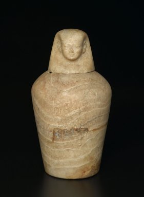  <em>Canopic Jar</em>, ca. 1980–1075 B.C.E. Egyptian alabaster (calcite), frit, 15 1/2 × Diam. 8 in. (39.4 × 20.3 cm). Brooklyn Museum, Charles Edwin Wilbour Fund, 37.1380Ea-b. Creative Commons-BY (Photo: Brooklyn Museum, 37.1380Ea-b_front_PS2.jpg)