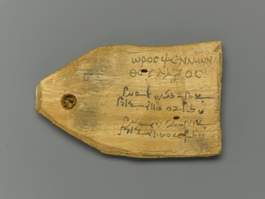  <em>Tag for Mummy of a Stonecutter, with Text in Greek and Demotic</em>, 30 B.C.E.-365 C.E. Wood, ink, 2 7/16 x 4 x 1/2 in. (6.2 x 10.2 x 1.2 cm). Brooklyn Museum, Charles Edwin Wilbour Fund, 37.1395E. Creative Commons-BY (Photo: Brooklyn Museum, 37.1395E_front_PS1.jpg)