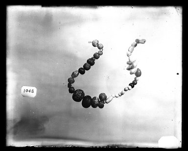  <em>Unrelated Beads</em>. Faience, glass, amethyst, shell, Greatest diam: 5/8 in. (1.6 cm). Brooklyn Museum, Charles Edwin Wilbour Fund, 37.1447E. Creative Commons-BY (Photo: Brooklyn Museum, 37.1447E_NegA_SL4.jpg)