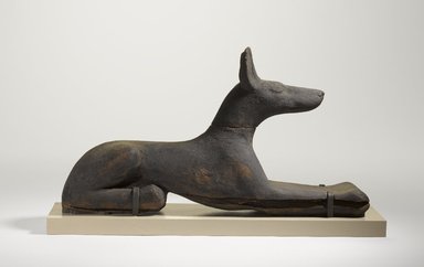  <em>Figure of Recumbent Jackal</em>, ca. 664-30 B.C.E. Wood, pigment, 7 13/16 x 14 in. (19.8 x 35.5 cm). Brooklyn Museum, Charles Edwin Wilbour Fund, 37.1482E. Creative Commons-BY (Photo: Brooklyn Museum, 37.1482E_PS9.jpg)