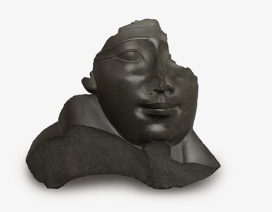  <em>Face and Shoulder from an Anthropoid Sarcophagus</em>, 332–30 B.C.E. Greywacke, 18 1/2 × 20 1/2 × 5 in., 38.5 lb. (47 × 52.1 × 12.7 cm, 17.46kg). Brooklyn Museum, Charles Edwin Wilbour Fund, 37.1516E. Creative Commons-BY (Photo: Brooklyn Museum, 37.1516E_edited_PS9.jpg)