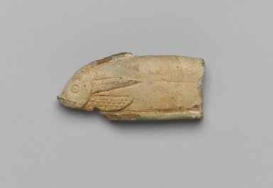 <em>Fish</em>, 664-332 B.C.E. Faience, 1 1/4 x 1/2 x 2 9/16 in. (3.1 x 1.2 x 6.5 cm). Brooklyn Museum, Charles Edwin Wilbour Fund, 37.1652E. Creative Commons-BY (Photo: Brooklyn Museum, 37.1652E_side1_PS2.jpg)