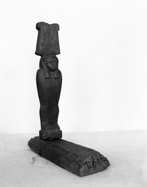  <em>Standing Mummiform Figure</em>. Wood, pigment, 37.1718Ea - figure: 13 7/16 x 2 13/16 x 1 5/8 in. (34.2 x 7.2 x 4.2 cm). Brooklyn Museum, Charles Edwin Wilbour Fund, 37.1718E. Creative Commons-BY (Photo: Brooklyn Museum, 37.1718E_NegA_glass_bw_SL4.jpg)