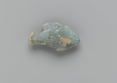  <em>Small Fish</em>, 664-332 B.C.E. Faience, 1 3/4 x 1 x 3 1/16 in. (4.4 x 2.5 x 7.7 cm). Brooklyn Museum, Charles Edwin Wilbour Fund, 37.1805E. Creative Commons-BY (Photo: Brooklyn Museum, 37.1805E_side1_PS2.jpg)