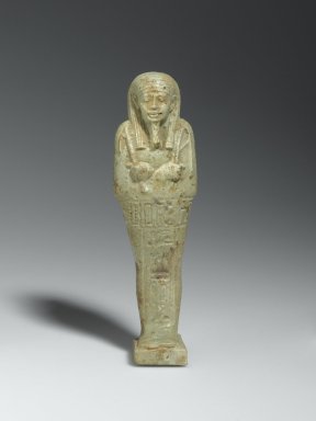  <em>Ushabti of the Priest Nesi-Kedwet</em>, 664–525 B.C.E. Faience, 5 11/16 x 1 9/16 x 1 3/16 in. (14.5 x 4 x 3 cm). Brooklyn Museum, Charles Edwin Wilbour Fund, 37.218E. Creative Commons-BY (Photo: Brooklyn Museum, 37.218E_front_PS2.jpg)