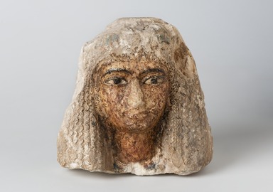  <em>Head of a Woman Wearing an Elaborate Wig</em>, ca. 1352-1190 B.C.E. Limestone, pigment, 6 3/4 × 4 3/4 × 7 1/4 in. (17.1 × 12.1 × 18.4 cm). Brooklyn Museum, Charles Edwin Wilbour Fund, 37.256E. Creative Commons-BY (Photo: Brooklyn Museum, 37.256E_overall_PS11.jpg)
