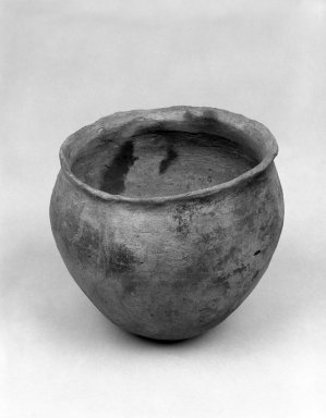 Mound Builder. <em>Blackened Plainware Jar</em>, 1200-1500C.E. Clay, slip, 5 11/16 x 6 1/8 in.  (14.5 x 15.5 cm). Brooklyn Museum, Frank Sherman Benson Fund and the Henry L. Batterman Fund, 37.2799PA. Creative Commons-BY (Photo: Brooklyn Museum, 37.2799PA_bw.jpg)