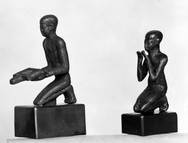  <em>Small Figurine of a Kneeling Man</em>, 664–332 B.C.E. Bronze, 1 3/4 x 9/16 x 7/8 in. (4.4 x 1.5 x 2.3 cm). Brooklyn Museum, Charles Edwin WIlbour Fund, 37.359E. Creative Commons-BY (Photo: , 37.362E_37.359E_NegA_glass_bw_SL4.jpg)