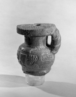  <em>Vessel with Handle</em>. Stone, 3 1/8 × 3 3/4 × 2 1/2 in. (7.9 × 9.5 × 6.4 cm). Brooklyn Museum, Designated Purchase Fund, 37.402. Creative Commons-BY (Photo: Brooklyn Museum, 37.402_acetate_bw.jpg)