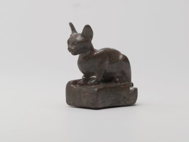  <em>Weight in Form of a Cat</em>, ca. 1550-30 B.C.E. Bronze, silver, lead, 2 1/4 x 1 1/8 x 2 3/8 in., 0.6 lb. (5.7 x 2.9 x 6 cm, 257.52 g). Brooklyn Museum, Charles Edwin Wilbour Fund, 37.424E. Creative Commons-BY (Photo: Brooklyn Museum, 37.424E_threequarter_PS2.jpg)