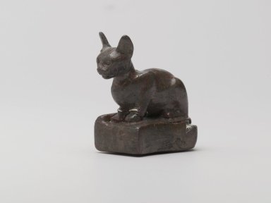  <em>Weight in Form of a Cat</em>, ca. 1550–30 B.C.E. Bronze, silver, lead, 2 1/4 x 1 1/8 x 2 3/8 in., 0.6 lb. (5.7 x 2.9 x 6 cm, 257.52 g). Brooklyn Museum, Charles Edwin Wilbour Fund, 37.424E. Creative Commons-BY (Photo: Brooklyn Museum, 37.424E_threequarter_PS2.jpg)