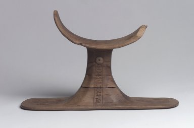  <em>Headrest with Bes-Image and Taweret</em>, ca. 1539-1425 B.C.E. B.C.E. Wood, 7 1/4 x 11 7/16 x 2 15/16 in. (18.4 x 29 x 7.5 cm). Brooklyn Museum, Charles Edwin Wilbour Fund, 37.440E. Creative Commons-BY (Photo: Brooklyn Museum, 37.440E_side1.jpg)