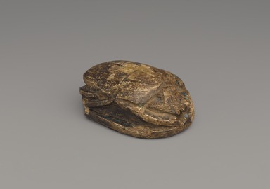  <em>Commemorative Lion Hunt Scarab of Amunhotep III</em>, ca. 1390-1352 B.C.E. Steatite, glaze, 1 5/16 x 2 5/16 x 3 7/16 in. (3.4 x 5.8 x 8.7 cm). Brooklyn Museum, Charles Edwin Wilbour Fund, 37.477E. Creative Commons-BY (Photo: Brooklyn Museum, 37.477E_threequarter_PS9.jpg)