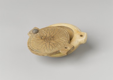  <em>Circular Cosmetic Container with Lid</em>, ca. 1539–1292 B.C.E. Elephant ivory, wood, pigment, frit (?), and resin (?), 1 5/8 × 3 1/2 in. (4.1 × 8.9 cm). Brooklyn Museum, Charles Edwin Wilbour Fund, 37.597Ea-b. Creative Commons-BY (Photo: Brooklyn Museum, 37.597Ea-b_view1_PS4.jpg)