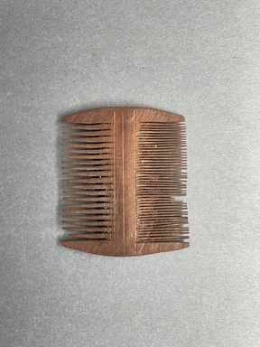  <em>Comb</em>, 395–642 C.E. Wood, 3 7/16 × 2 15/16 × 3/8 in. (8.7 × 7.4 × 1 cm). Brooklyn Museum, Charles Edwin Wilbour Fund, 37.671E. Creative Commons-BY (Photo: Brooklyn Museum, 37.671E_overall01.JPG)