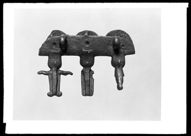  <em>Terminal Ornamented with Three Heads of the Osirian Triad</em>, ca. 664-525 B.C.E. or later. Bronze, 2 5/8 x 3 3/4 x 1 3/16 in. (6.6 x 9.5 x 3 cm). Brooklyn Museum, Charles Edwin Wilbour Fund, 37.687E. Creative Commons-BY (Photo: Brooklyn Museum, 37.687E_NegA_SL4.jpg)