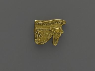 Egyptian. <em>Wadjet-eye Amulet</em>, 525–343 B.C.E. Gold, 3/4 x 1/2 x 1/8 in. (1.9 x 1.3 x 0.3 cm). Brooklyn Museum, Charles Edwin Wilbour Fund, 37.795E. Creative Commons-BY (Photo: Brooklyn Museum, 37.795E_front_PS2.jpg)
