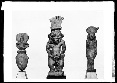  <em>Isis Amulet</em>, 305–30 B.C.E. Faience, 2 11/16 x 11/16 x 11/16 in. (6.9 x 1.7 x 1.7 cm). Brooklyn Museum, Charles Edwin Wilbour Fund, 37.1078E. Creative Commons-BY (Photo: , 37.887E_37.925E_37.1078E_GrpA_SL4.jpg)