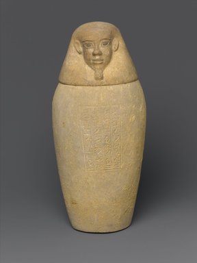  <em>Canopic Jar and Lid (Depicting a Human)</em>, 664–404 B.C.E. Limestone, 10 7/16 in. (26.5 cm) high x 4 1.2 in. (11.4 cm) diameter. Brooklyn Museum, Charles Edwin Wilbour Fund, 37.896Ea-b. Creative Commons-BY (Photo: Brooklyn Museum, 37.896Ea-b_front_PS1.jpg)